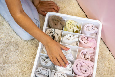 Cropped image of woman organizing drawer