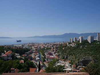 High angle view of townscape against clear blue sky