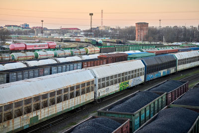 High angle view of train at railroad station against sky