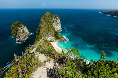 High angle view of rocks on sea shore