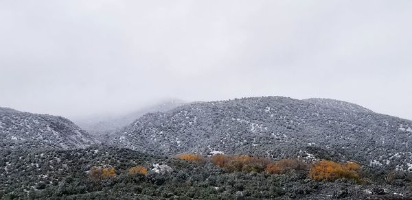 Scenic view of mountains against sky during winter