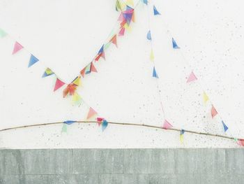 Colorful buntings against wall