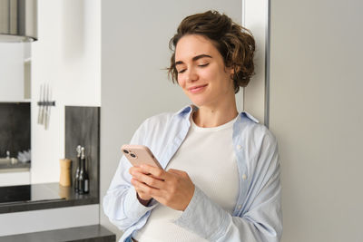 Young woman using mobile phone