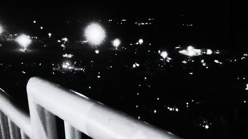 Low angle view of illuminated lights at night