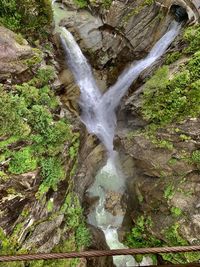 Water flowing through rocks in forest