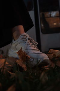 Low section of man relaxing in the dark