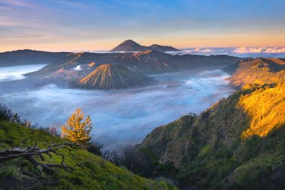 Scenic view of mountain range against sky during sunset