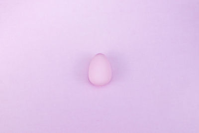 Close-up of pink over white background