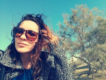 Portrait of young woman in sunglasses