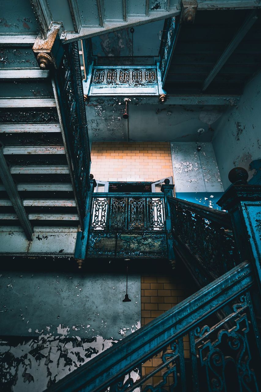 architecture, staircase, built structure, indoors, no people, abandoned, high angle view, building, metal, railing, damaged, steps and staircases, old, obsolete, deterioration, weathered, decline, run-down, day, ruined