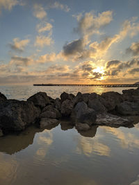Scenic view of sea against sky during sunset