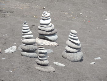 High angle view of chess pieces on sand