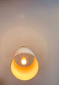 Low angle view of illuminated lamp against sky