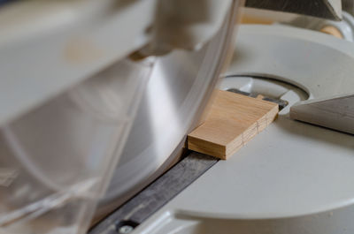 Cutting a wooden board on carpentry machine. woodworking industry.