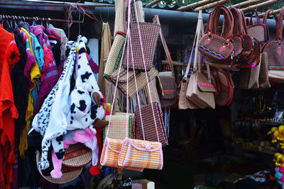 Clothes hanging in store for sale at market stall