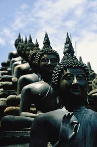 Low angle view of statue against sky