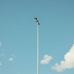 Low angle view of street light against sky
