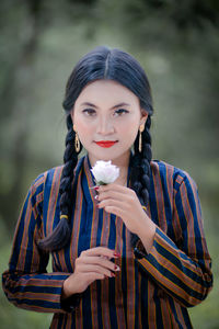 Portrait of smiling young woman in traditional clothing