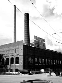 Low angle view of factory against sky