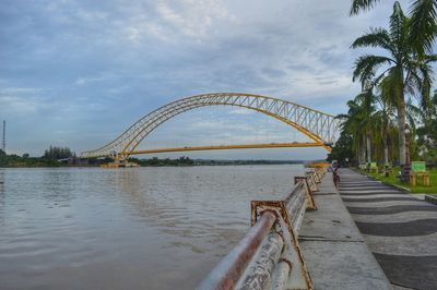 Bridge over river against sky