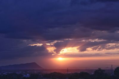 Scenic view of silhouette mountains against sky during sunset