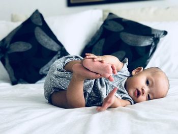 Close-up of baby sleeping on bed