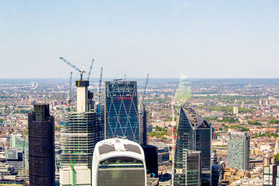 Modern buildings in city against sky