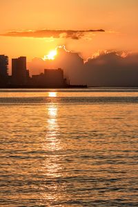 Scenic view of sea against orange sky