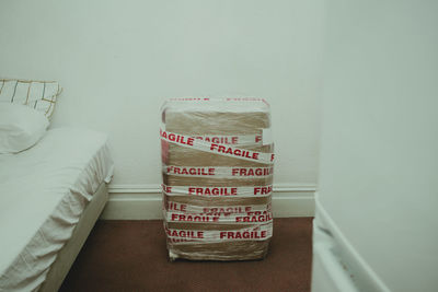 View of package by bed at bedroom