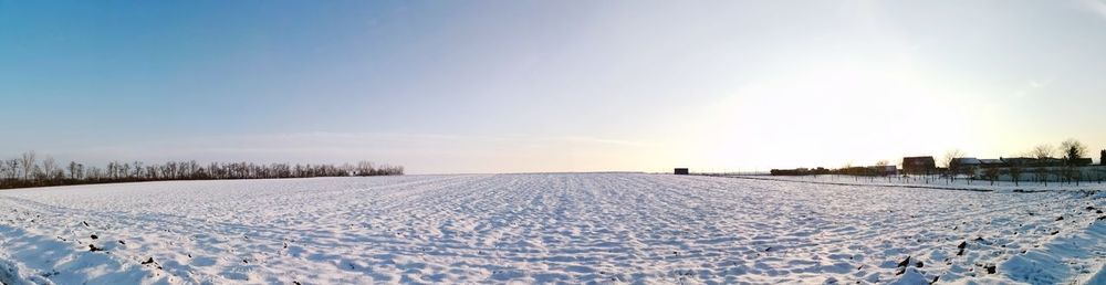 Scenic view of snow field against clear sky