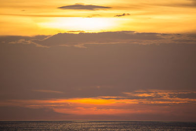 Scenic view of sea against romantic sky at sunset