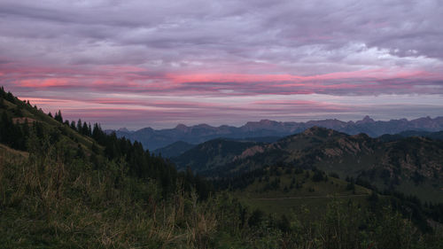 Scenic view of mountains against sky during sunset