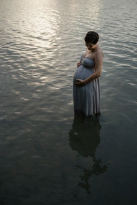 Woman standing in lake