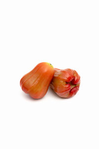 Close-up of tomato against white background