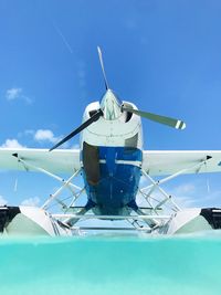 Low angle view of airplane against sky