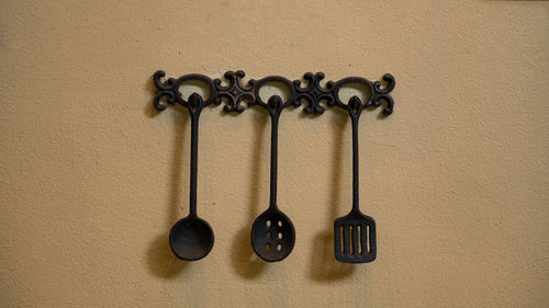 Close-up of objects hanging on wall