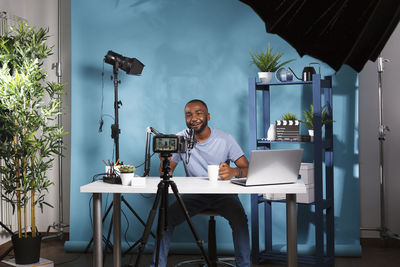 Midsection of man working on table