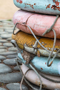 Close up of old weathered lifebuoys awaiting restoration and painting. vertical shot.