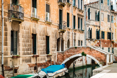 Grand canal amidst buildings against sky