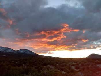 Scenic view of mountains against sky during sunset