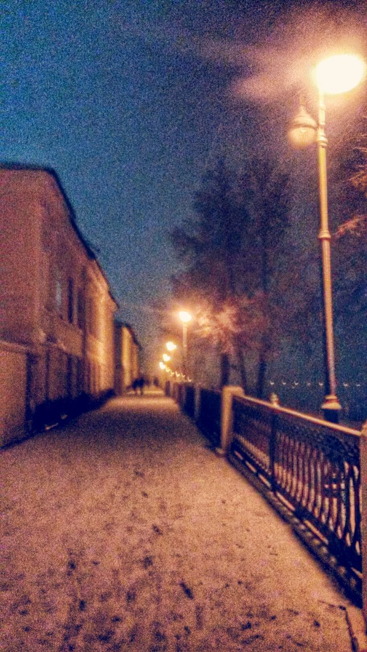 ILLUMINATED STREET LIGHT AGAINST SKY AT NIGHT