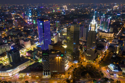 High angle view of illuminated city buildings at night