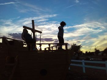 Low angle view of building against cloudy sky