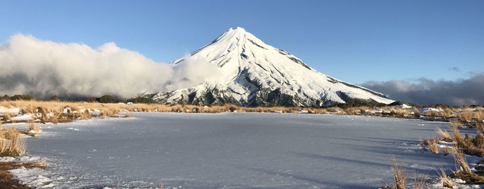 Scenic view of snowcapped mountains against sky