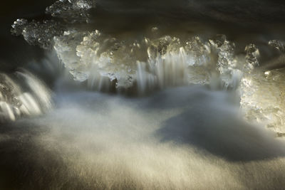 Close-up of water flowing over sea