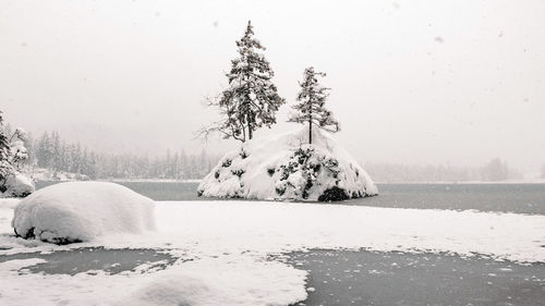 Winter landscape, frozen lake, trees, snow, outdoors.