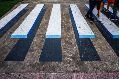 Low section of people crossing road