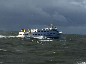 Boats in sea against sky