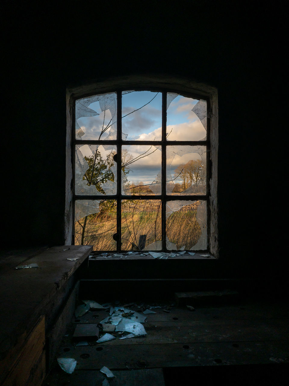 WINDOW OF ABANDONED HOUSE
