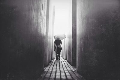 Full length of woman walking on road